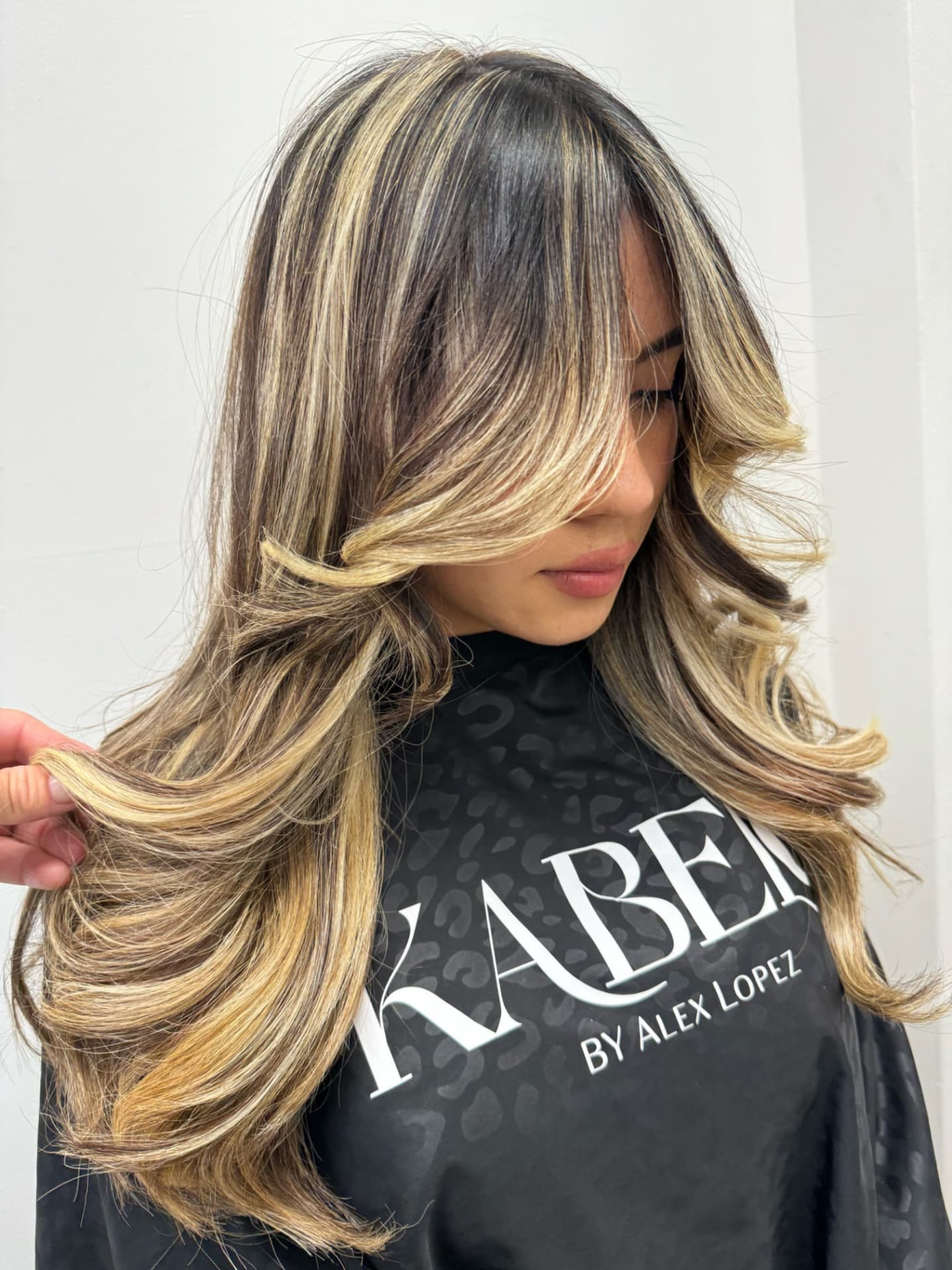 Dark hair with bold blonde streaks and long layers