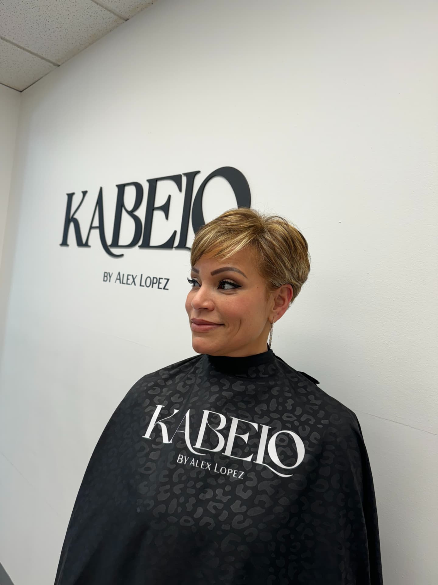 Short textured pixie cut with honey highlights